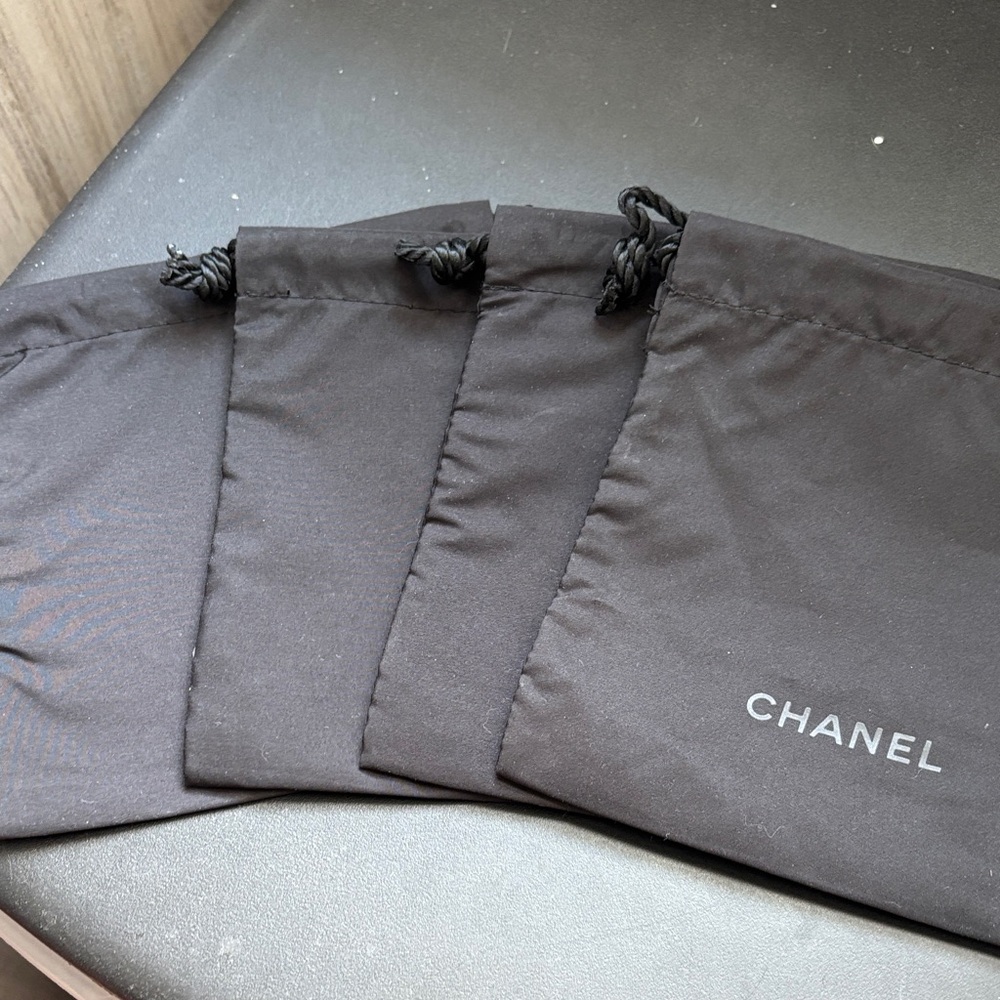 CHANEL Black Drawstring Pouches Set of 4
